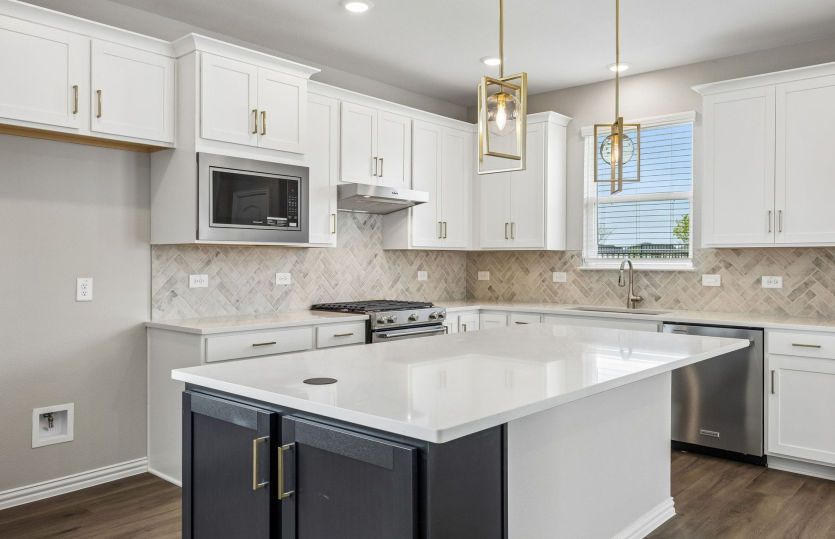 Beautiful kitchen with pendent lighting