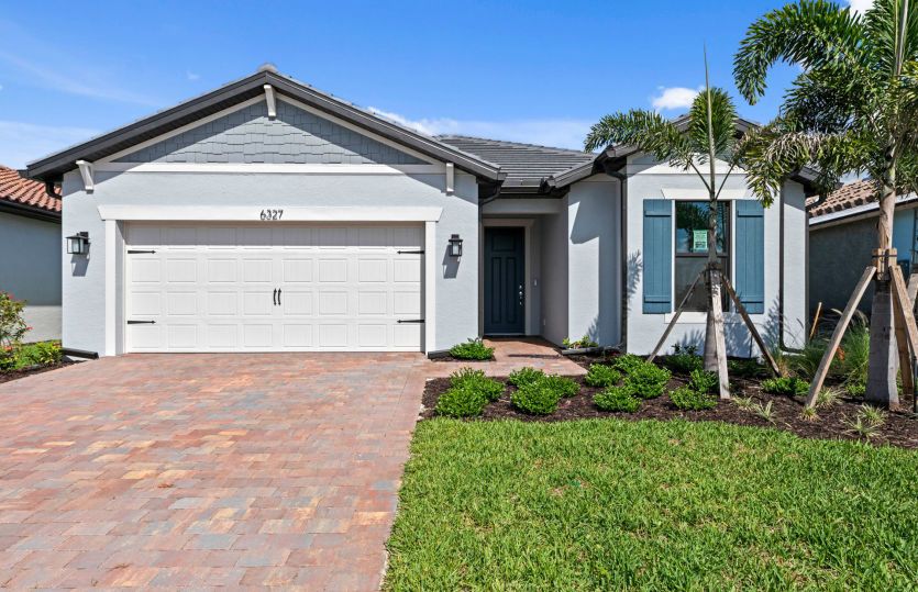 Welcoming exterior of this home with impact glass windows