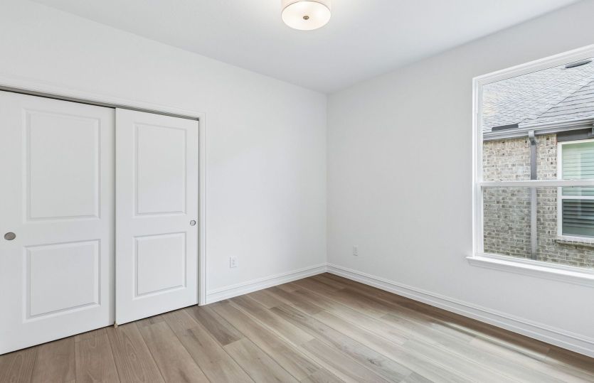 Spacious secondary bedroom with large window