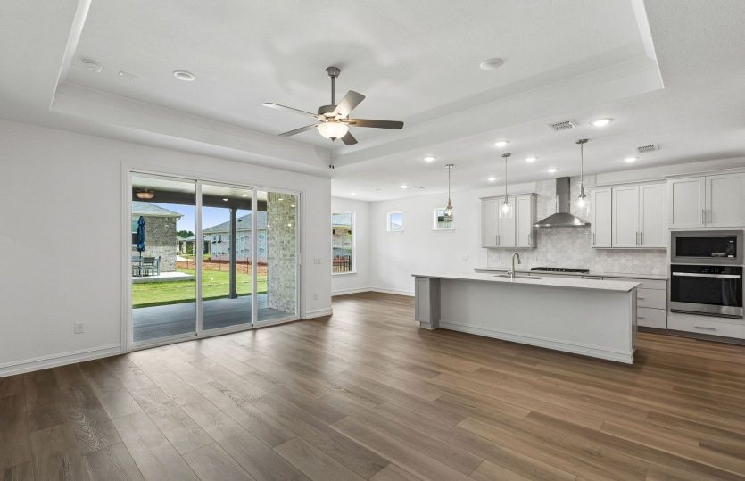 Spacious gathering room with tray ceiling