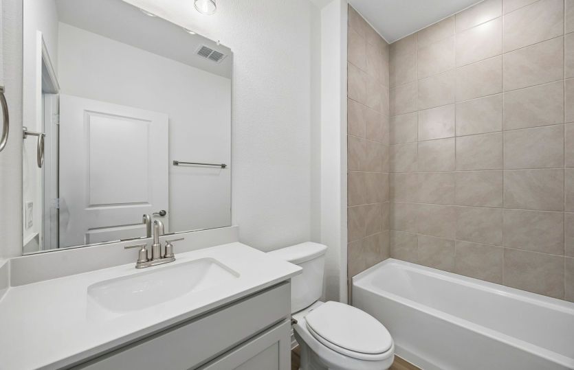 Secondary bath with tile surrounded shower