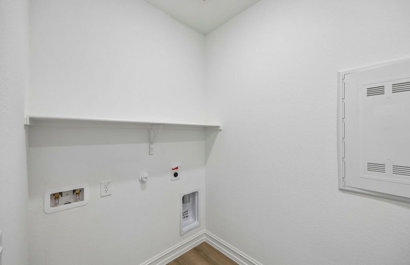Laundry room with built-in shelving