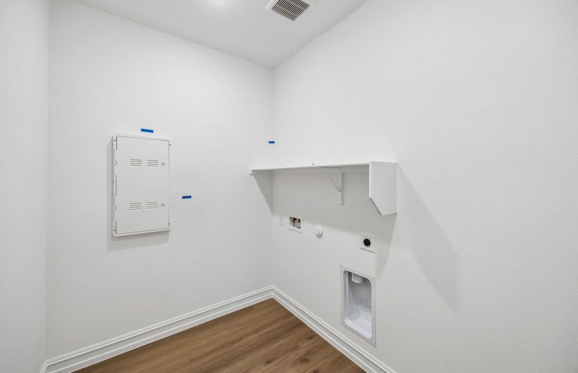 Laundry room with built-in shelving