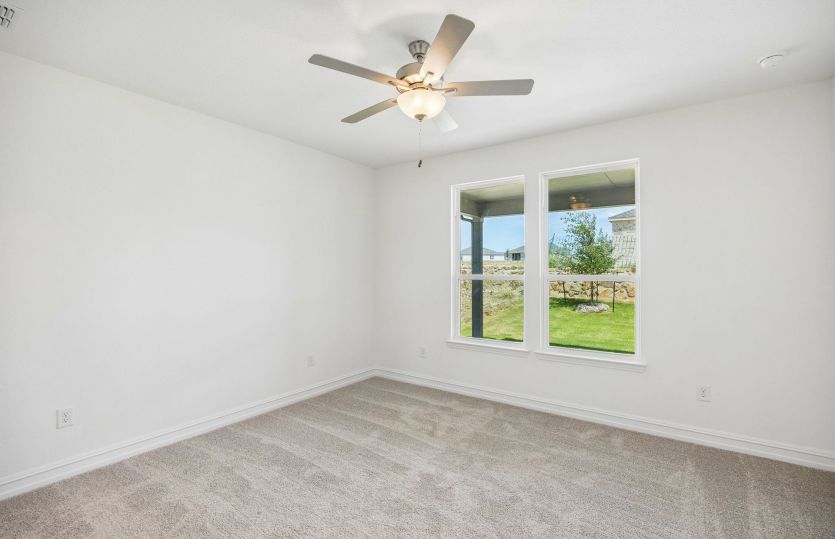 Primary bedroom with large window