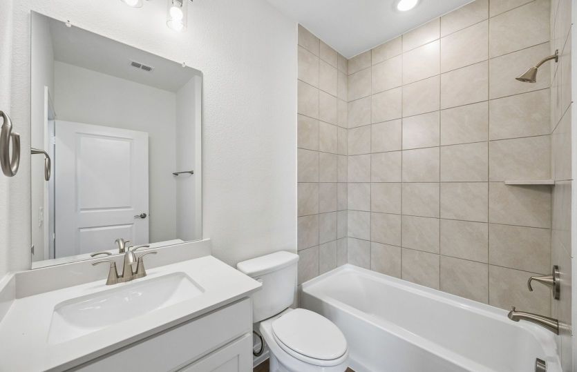 Secondary bath with tile surrounded shower