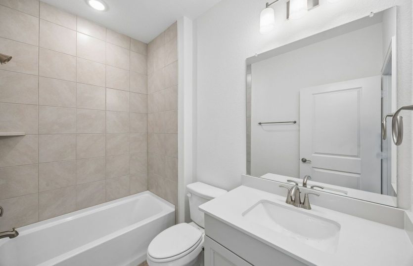 Secondary bath with tile surrounded shower