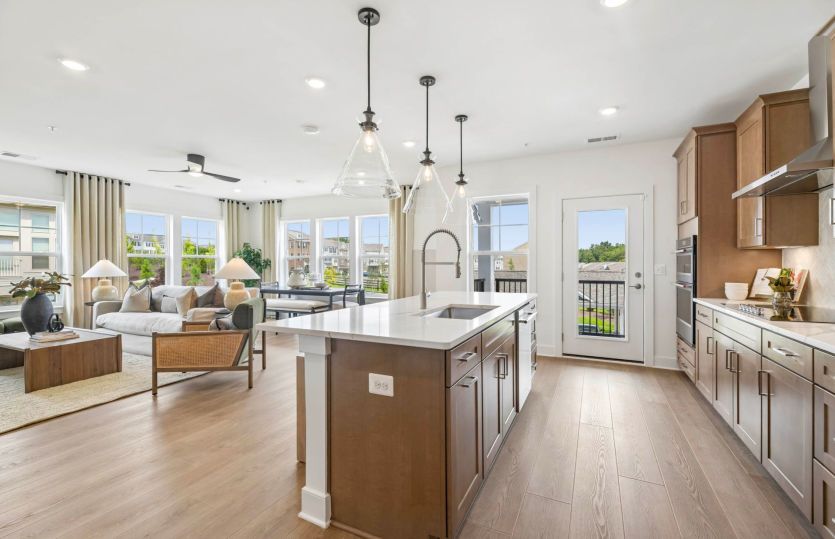 Kitchen Overlooks Dining Room and Gathering Room