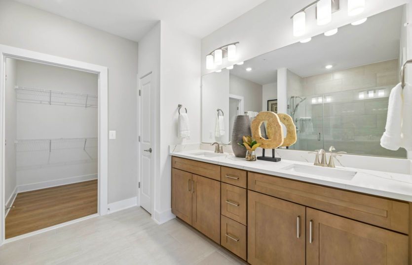 Luxurious Owner's Bathroom with Dual Sinks and Access to the Walk-in Closet