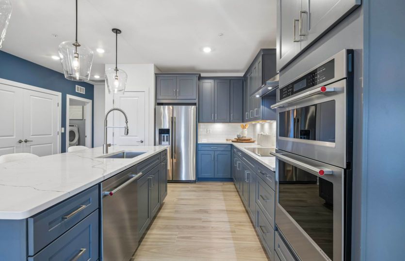 Quartz Countertops and Gray Cabinetry in the Gourmet Kitchen
