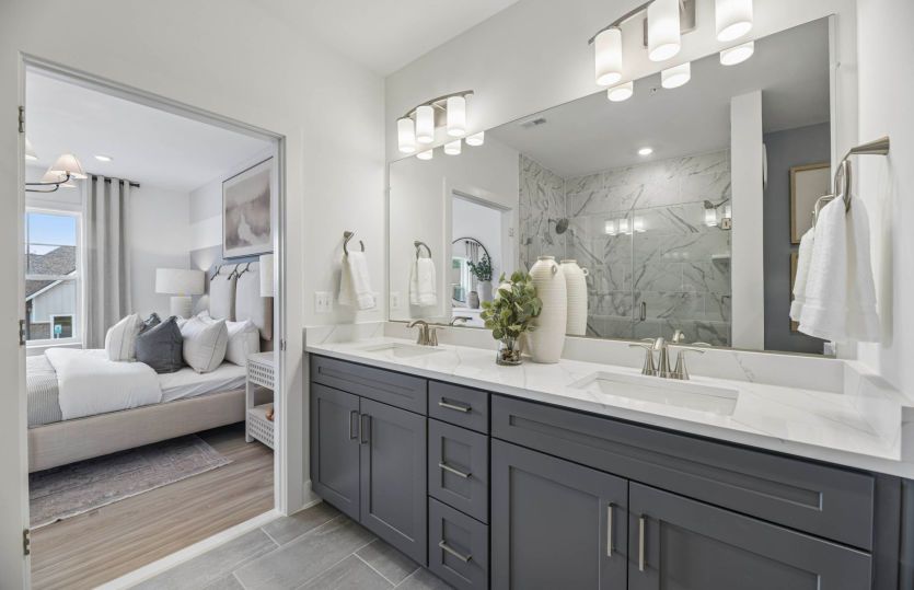 Owner's Bath with Dual Sinks and a Frameless Walk-in Shower