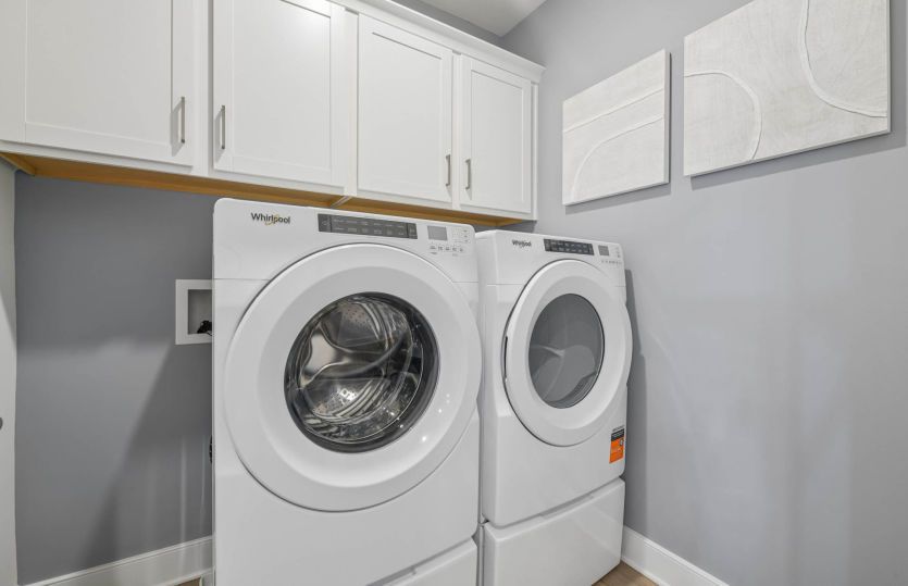 Laundry Room with Additional Cabinets for Storage