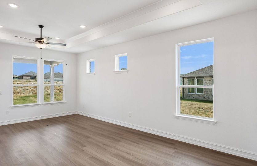 Large windows and tray ceiling in living room