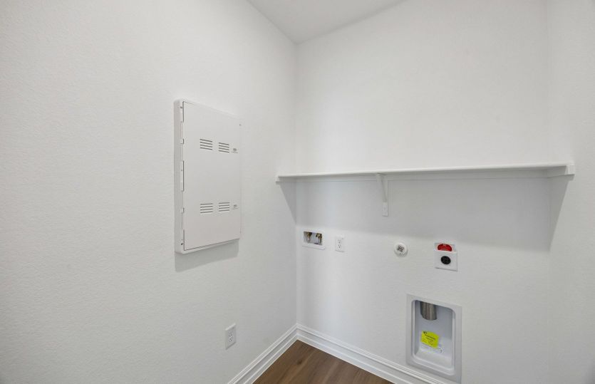 Laundry room with built-in shelving