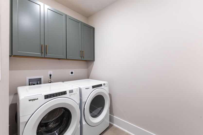 Convenient laundry room.