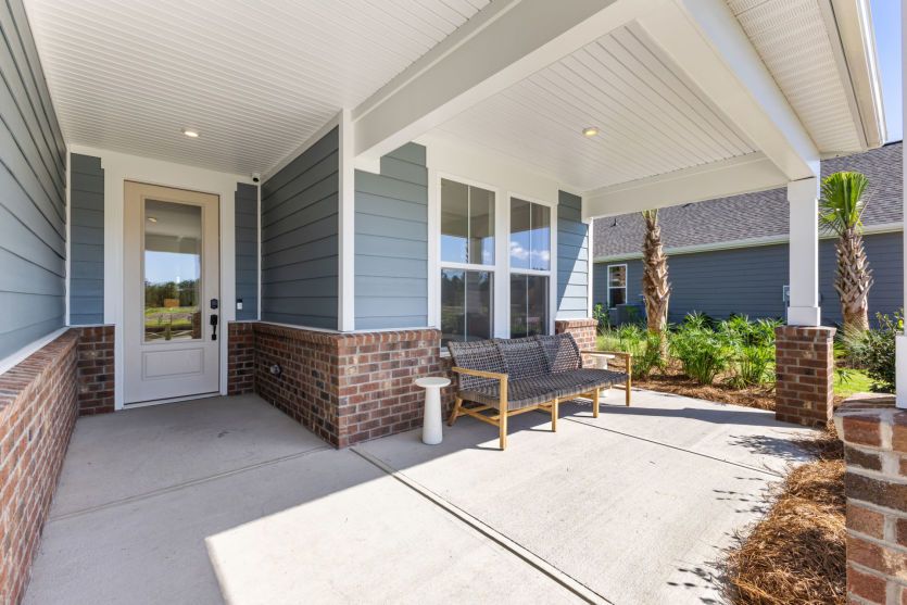 Charming front porch with welcoming curb appeal.