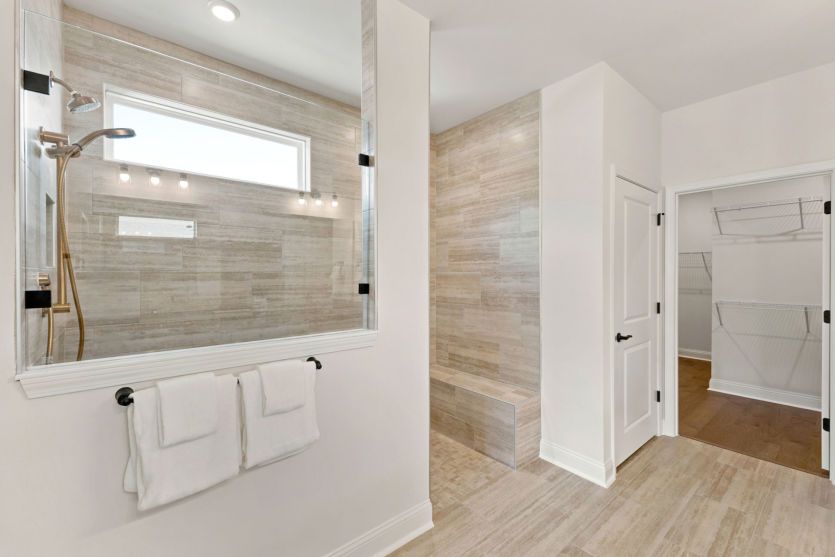 Modern owner's suite bathroom with functional design.