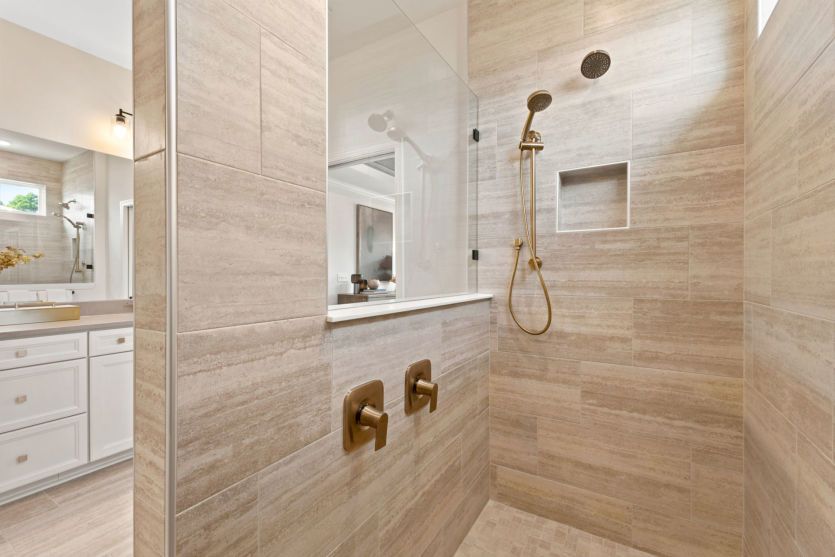 Modern owner's suite bathroom with functional design.
