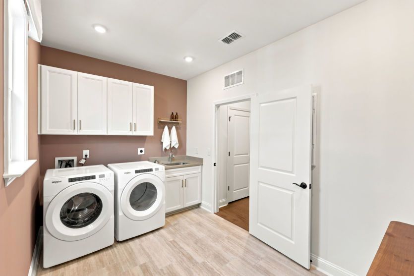 Convenient laundry room with functional storage.