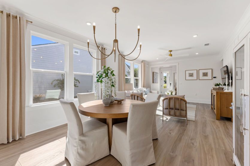 Charming dining room flows from the kitchen space, ideal for enjoying a delicious meal.