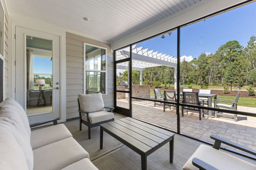 Screened porch with plenty of space for outdoor furniture.