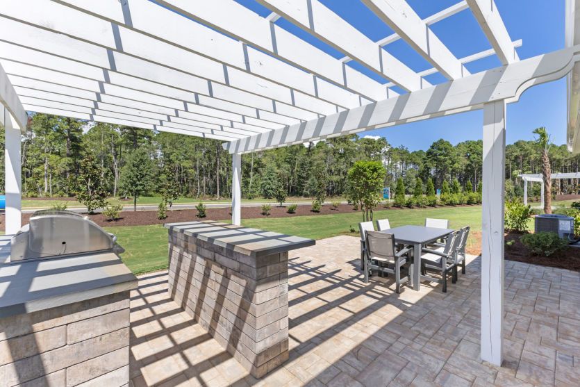 Outdoor Patio to enjoy the pleasant Coastal climate and beautiful backyard view.