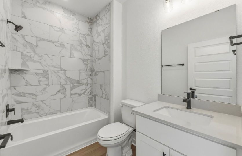Secondary bath with tile surrounded shower