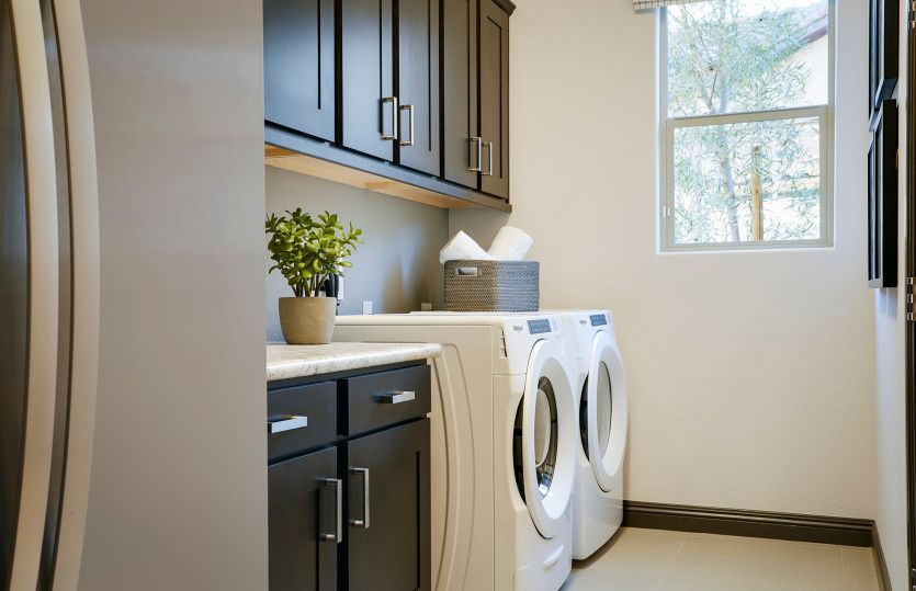 Upper Cabinets and Refrigerator in Laundry Room
