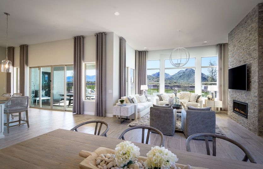 The spacious gathering room includes bright windows and a great space for entertaining guests