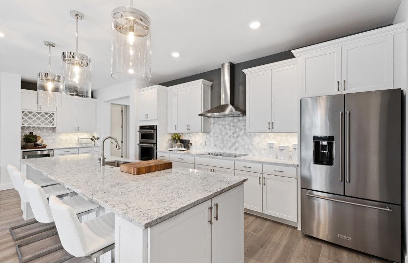 Open concept kitchen with stainless steel appliances