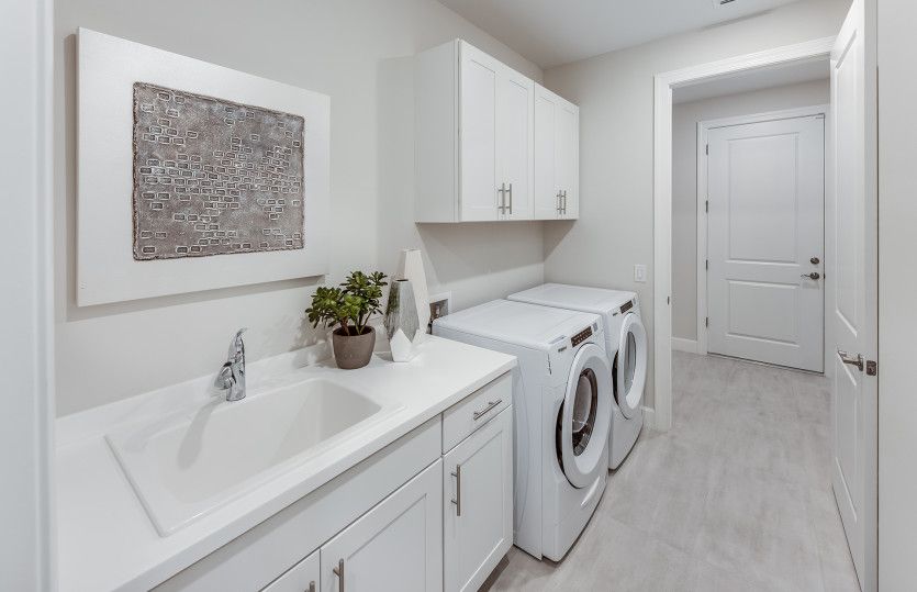 Large laundry room with a flow through layout
