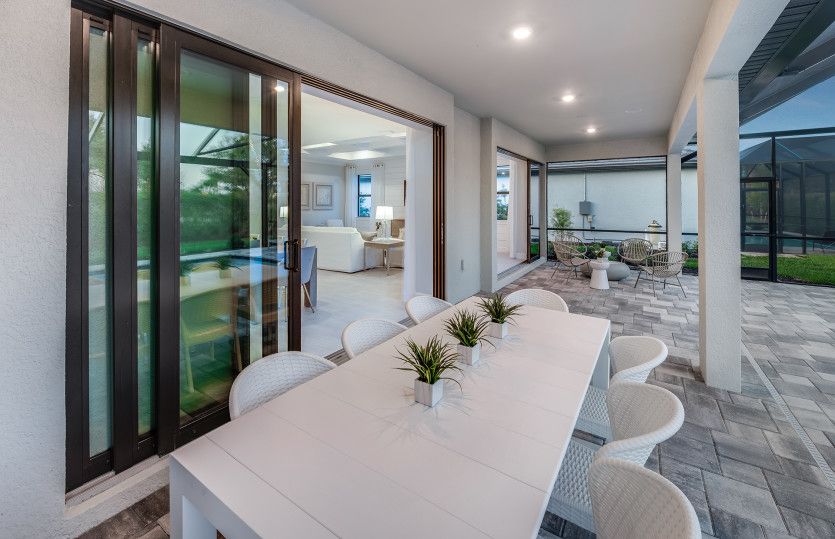 Covered screened-in lanai with pocket sliding glass doors