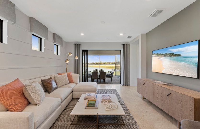 Gathering room with sliding glass door leading the to the lanai