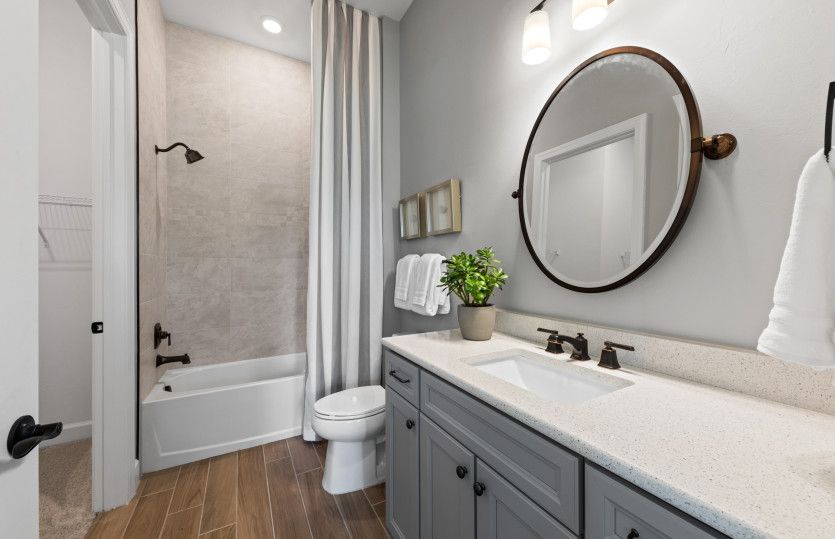 Secondary bathroom with tub and shower combination