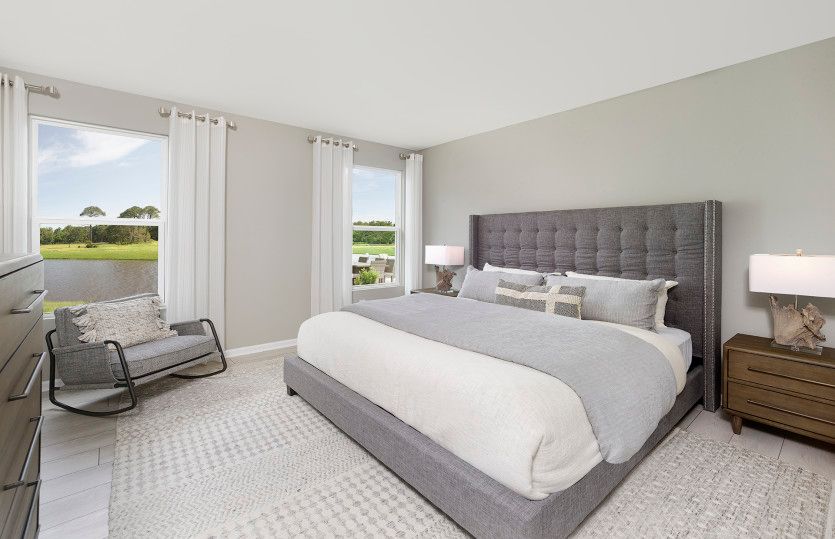 Large Owner's Suite Bedroom with large windows to bring in natural lighting. Model Representation.