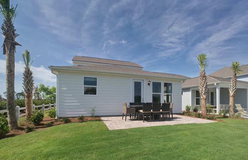 Stroll outside to the back patio and enjoy the breeze year-round. Model Representation.