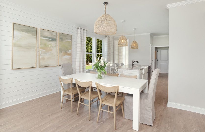 Dining Area with a lovely Shiplap wall. Model Representation.
