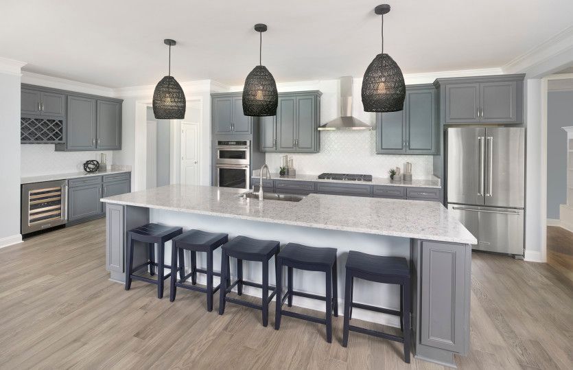 Open Kitchen with a large island that flows into the Gathering Room