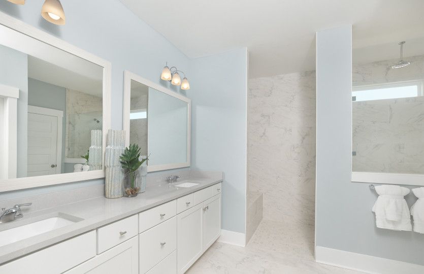 Desirable Owner's Bath with a walk-in shower and dual vanity