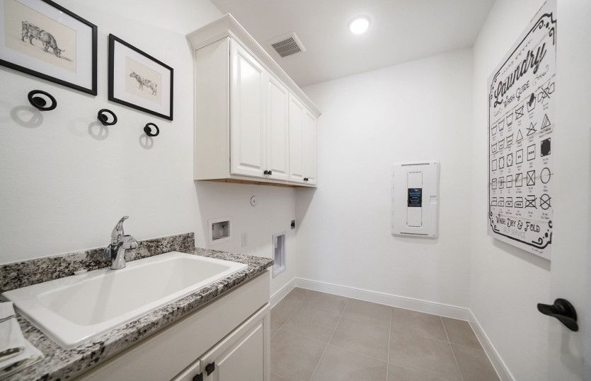 Laundry Room with Cabinets and Sink