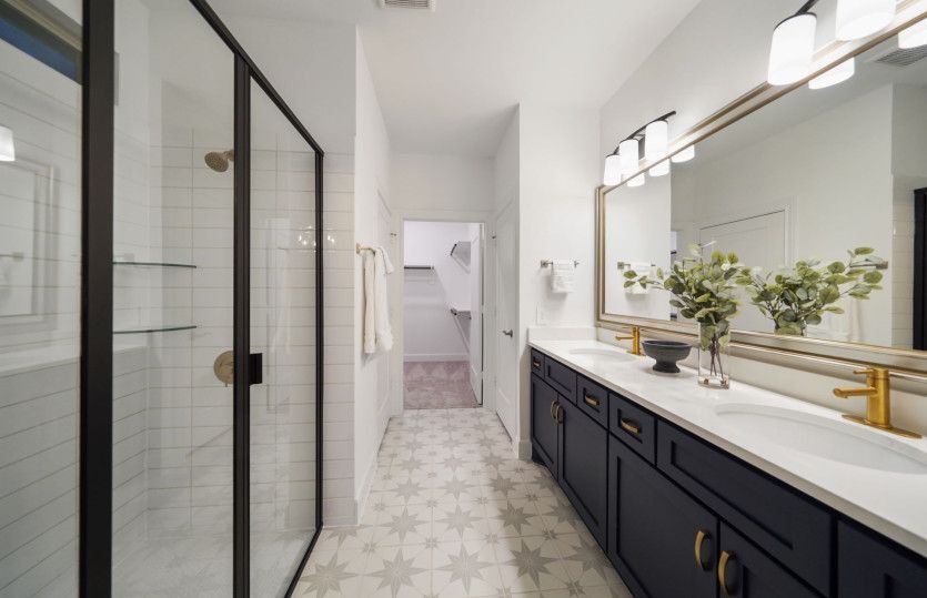 Owner's Bath with Walk-In Shower and Dual Vanities