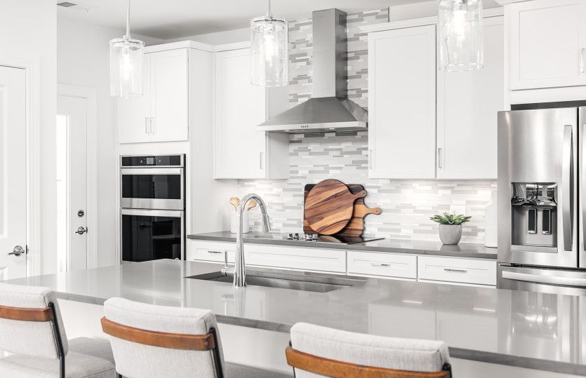 Quartz Countertops and White Cabinetry in the Gourmet Kitchen