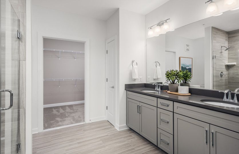 Luxurious Owner's Bathroom with Dual Sinks and Access to the Walk-in Closet