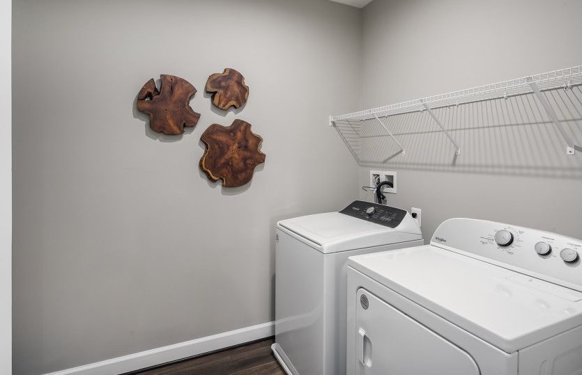 Full Size Washer and Dryer with Shelving in Laundry Room