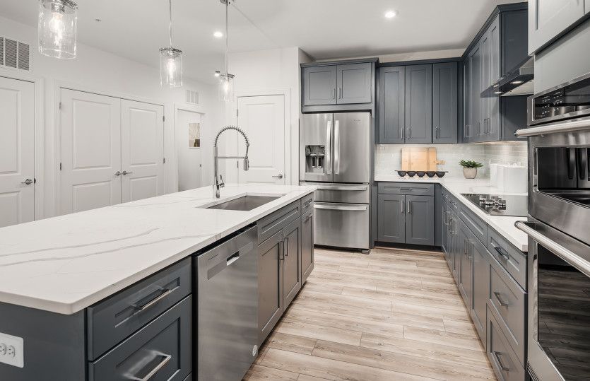 Quartz Countertops and Gray Cabinetry in the Gourmet Kitchen