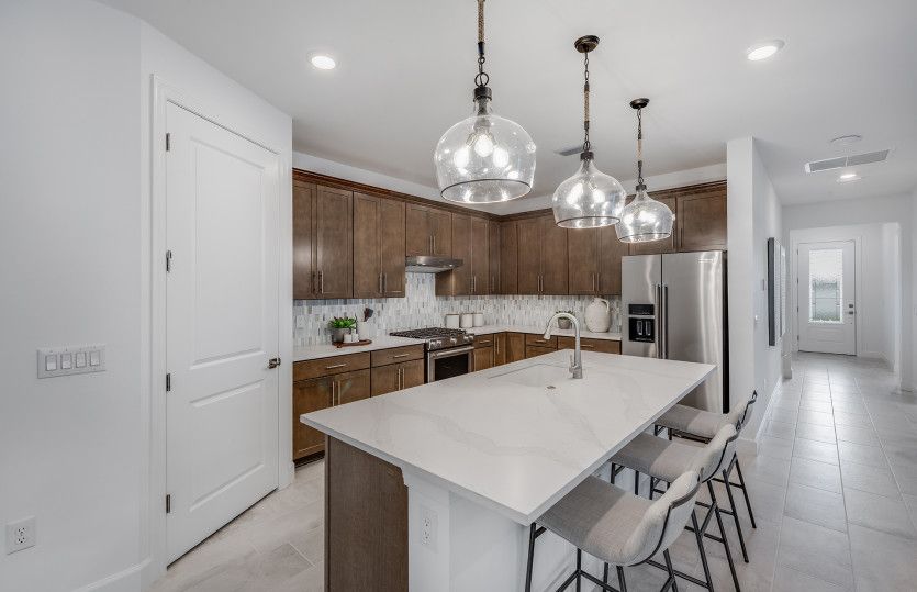 Kitchen with decorative back-splash and large center island