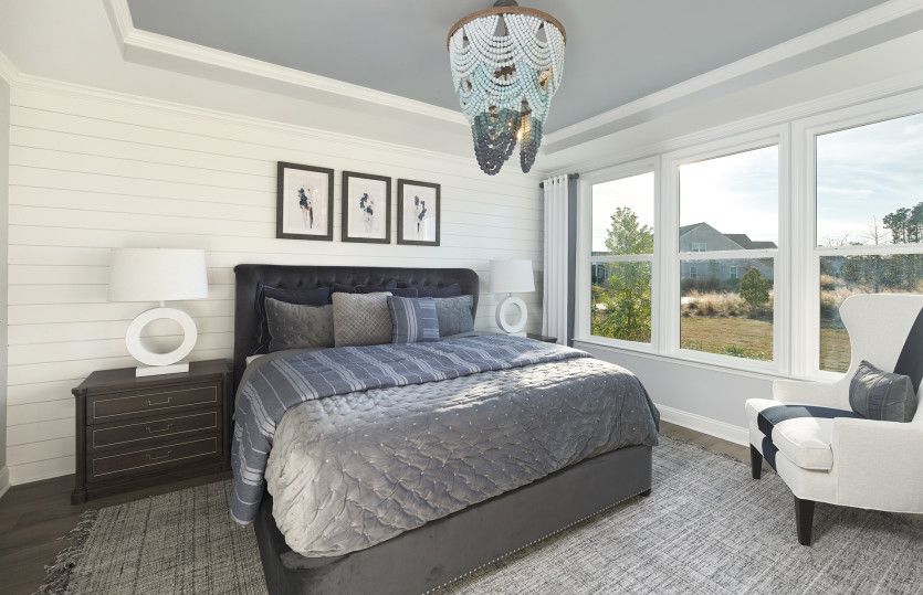 Oversized Owner's Suite with a tray celling.