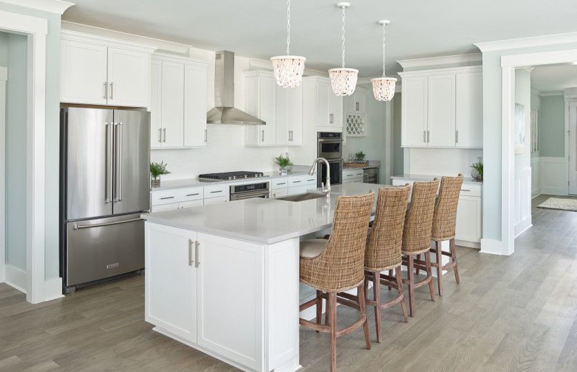 Stainless Stainless appliance, hardwood floors, and sleek countertops make cleaning up the Kitchen a