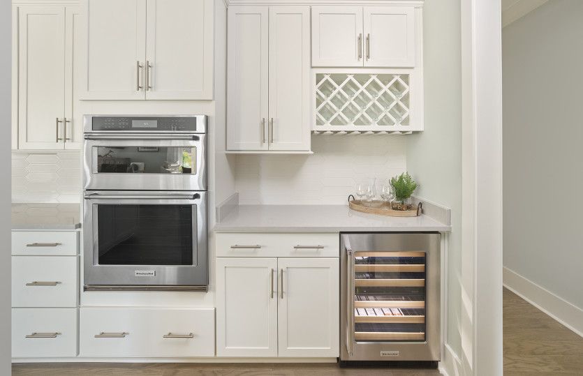 Bright white Beverage Center and wall oven.