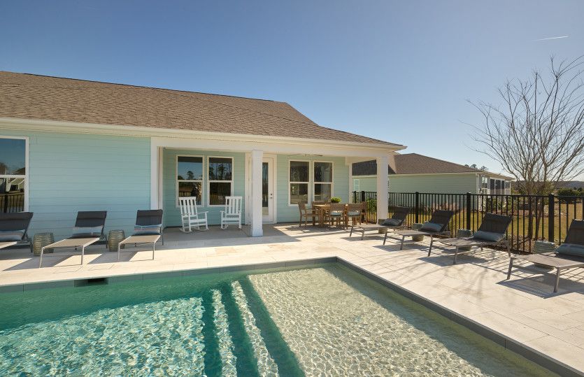 There is room for everyone to lounge poolside.