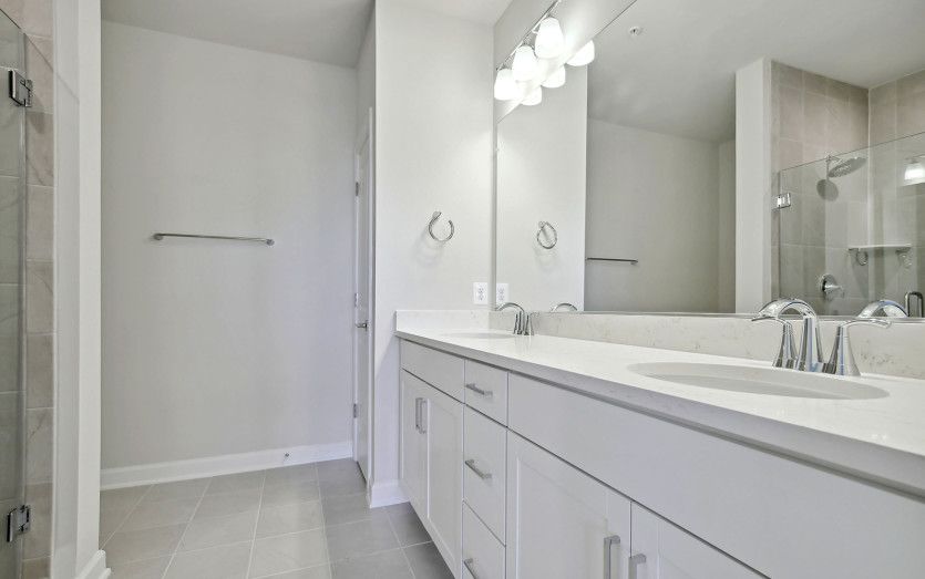 Owner's Bath with Shower Seat and Double Vanity